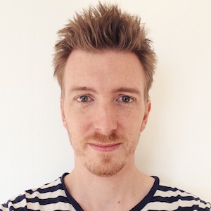 Photograph of me, Morgan, venitian-blond-haired white male with green eyes, a goatee and a faux hawk hair cut, wearing a breton striped t-shirt